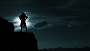 Preview wallpaper silhouette, man, hill, sky, clouds
