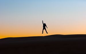 Preview wallpaper silhouette, man, jump, sky, night
