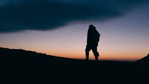 Preview wallpaper silhouette, man, night, freedom, sky, clouds