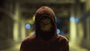 Preview wallpaper silhouette, mask, hood, clock, glare