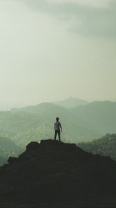 Preview wallpaper silhouette, mountains, fog, peak, loneliness, freedom