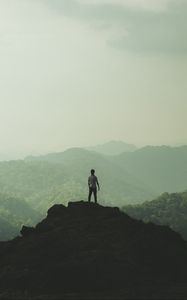 Preview wallpaper silhouette, mountains, fog, peak, loneliness, freedom