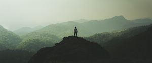 Preview wallpaper silhouette, mountains, fog, peak, loneliness, freedom