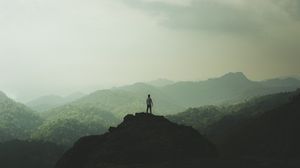 Preview wallpaper silhouette, mountains, fog, peak, loneliness, freedom