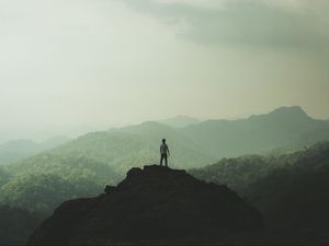 Preview wallpaper silhouette, mountains, fog, peak, loneliness, freedom