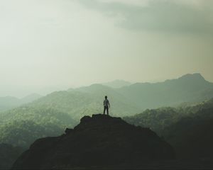 Preview wallpaper silhouette, mountains, fog, peak, loneliness, freedom