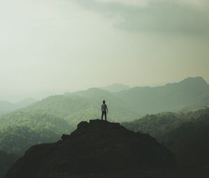 Preview wallpaper silhouette, mountains, fog, peak, loneliness, freedom