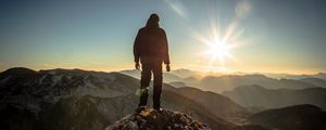 Preview wallpaper silhouette, mountains, sunlight, peaks, dawn, glare