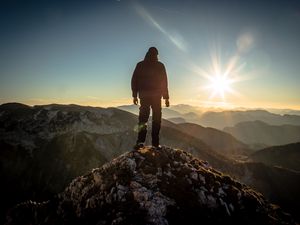 Preview wallpaper silhouette, mountains, sunlight, peaks, dawn, glare