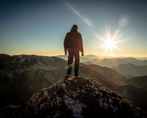 Preview wallpaper silhouette, mountains, sunlight, peaks, dawn, glare