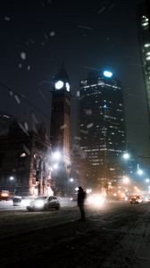 Preview wallpaper silhouette, night city, snowfall, street, city lights
