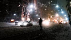 Preview wallpaper silhouette, night city, snowfall, street, city lights