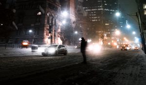 Preview wallpaper silhouette, night city, snowfall, street, city lights