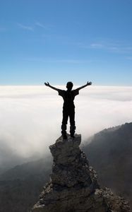 Preview wallpaper silhouette, people, rocks, sky, top