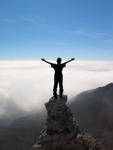 Preview wallpaper silhouette, people, rocks, sky, top