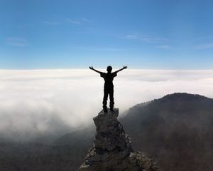 Preview wallpaper silhouette, people, rocks, sky, top