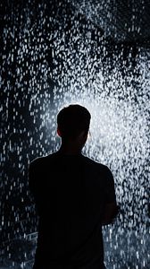 Preview wallpaper silhouette, rain, light, sparks, shine