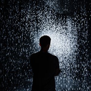 Preview wallpaper silhouette, rain, light, sparks, shine