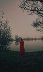 Preview wallpaper silhouette, red, cloak, lake, shore