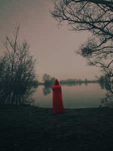 Preview wallpaper silhouette, red, cloak, lake, shore