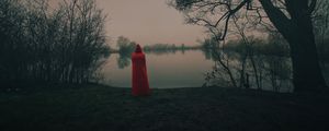 Preview wallpaper silhouette, red, cloak, lake, shore