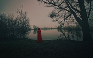 Preview wallpaper silhouette, red, cloak, lake, shore