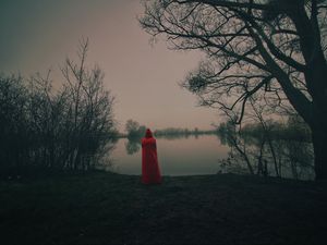 Preview wallpaper silhouette, red, cloak, lake, shore