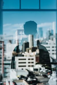 Preview wallpaper silhouette, reflection, window, city, buildings