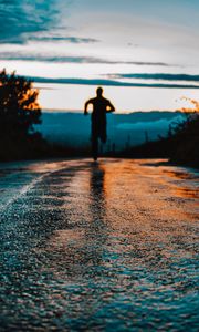 Preview wallpaper silhouette, road, running, asphalt, wet