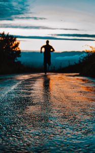 Preview wallpaper silhouette, road, running, asphalt, wet