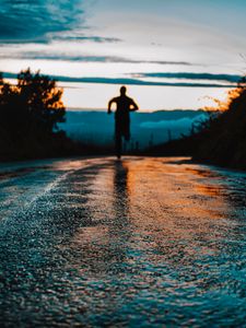 Preview wallpaper silhouette, road, running, asphalt, wet