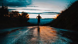 Preview wallpaper silhouette, road, running, asphalt, wet