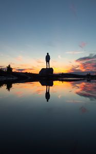 Preview wallpaper silhouette, rock, alone, water, reflection