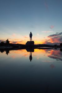 Preview wallpaper silhouette, rock, alone, water, reflection