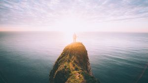 Preview wallpaper silhouette, rock, sunset, sea, sunlight, cliff