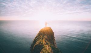 Preview wallpaper silhouette, rock, sunset, sea, sunlight, cliff