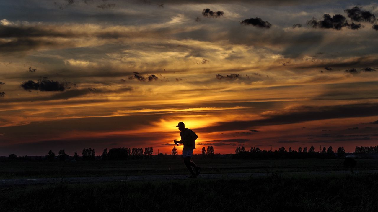 Wallpaper silhouette, running, sunset, athlete, clouds, sky