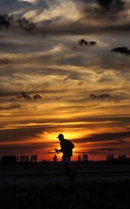 Preview wallpaper silhouette, running, sunset, athlete, clouds, sky