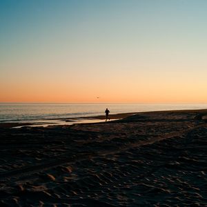 Preview wallpaper silhouette, sea, coast, sunset, sand