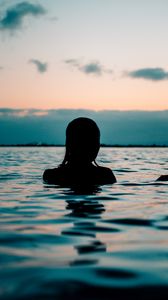 Preview wallpaper silhouette, sea, sunset, swimming, ripples