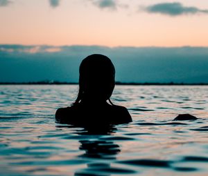 Preview wallpaper silhouette, sea, sunset, swimming, ripples