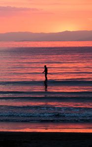 Preview wallpaper silhouette, sea, waves, sunset