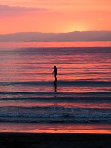 Preview wallpaper silhouette, sea, waves, sunset