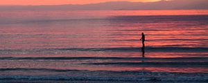 Preview wallpaper silhouette, sea, waves, sunset