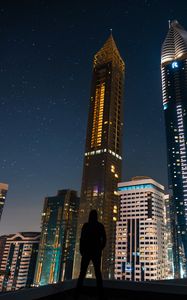 Preview wallpaper silhouette, skyscrapers, night city, night, architecture, lonely, loneliness, dubai