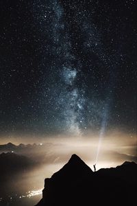 Preview wallpaper silhouette, starry sky, lighting, mountains
