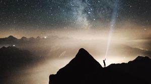 Preview wallpaper silhouette, starry sky, lighting, mountains