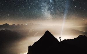 Preview wallpaper silhouette, starry sky, lighting, mountains