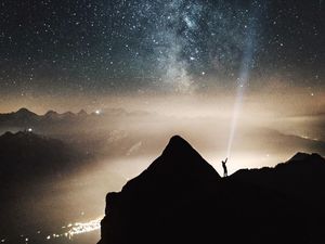 Preview wallpaper silhouette, starry sky, lighting, mountains