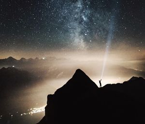 Preview wallpaper silhouette, starry sky, lighting, mountains